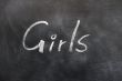 Girls - word written in white chalk