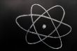 symbol of atom sketched on a blackboard