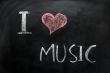 I love music - text written on a blackboard