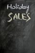 Holiday sales written on a blackboard