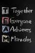 TEAM acronym written in colorful chalk
