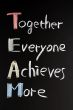 Teamwork concept on blackboard