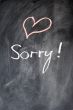 Sorry written on blackboard