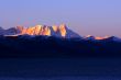 Landscape of snow-capped mountains at lakeside