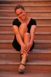 Woman sitting on stairs