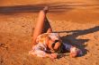 woman lying in the sand