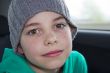 closeup of cute young teen boy in gray hat