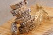 A stack of slices of bread with grains