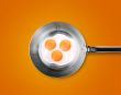 Three Fried eggs in a frying pan 