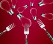 Forks around light bulb 