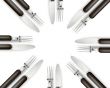 Empty copy space circle in set of knives and forks