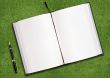 Blank book on grass