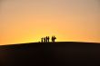 Silhouette of travelers at sunset