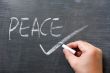 Peace - word written on a blackboard