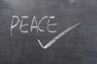 Peace - word written on a blackboard