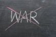 War - word crossed out with red chalk 