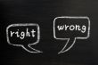 Two speech bubbles for right and wrong on a blackboard