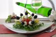 Appetizer of mozzarella, cherry tomatoes and olives with Arugula