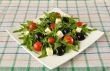 Salad of arugula with cherry tomatoes and grapes