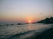 Round sun falling down over the Black sea