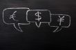 Three speech bubbles for Euro, dollar and yuan