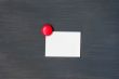 Blank stick note on a blackboard