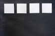 Blank stick note on a blackboard