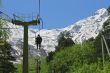 People on the chairs of cableway. Caucasian mountains