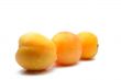 Juicy apricots on a white background