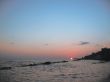 Round sun falling down over the Black sea