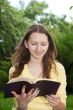 Teen girl reading book