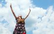 Teen girl with raised hands