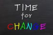 Time for change, colorful words on blackboard