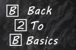 Acronym of B2B for Back to basics written on a smudged blackboard 