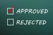 Check boxes for approved and rejected on a green chalkboard 