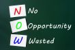 Acronym of NOW - No Opportunity Wasted on a chalkboard 