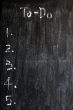 Blank to-do list on a smudged blackboard