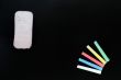 Colorful chalk and eraser on a blank blackboard