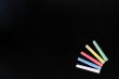 Colorful chalk on a blank blackboard