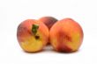 Juicy peaches on a white background