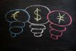 Euro, dollar and yuan symbol drawn with chalk on a blackboard