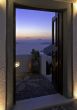 Santorini Caldera twilight view trough the open door