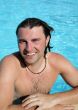 Man posing in pool