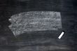 Smudged blackboard background with chalk and copy space