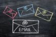 Chalk drawing of email symbols on a blackboard 