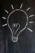 Light bulb drawn on a blackboard 