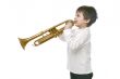 Boy playing on a trumpet