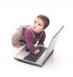 Baby girl with a laptop