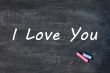 I love you - written with chalk on a Smudged blackboard background