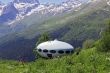 People around UFO that landing between caucasus mountains
